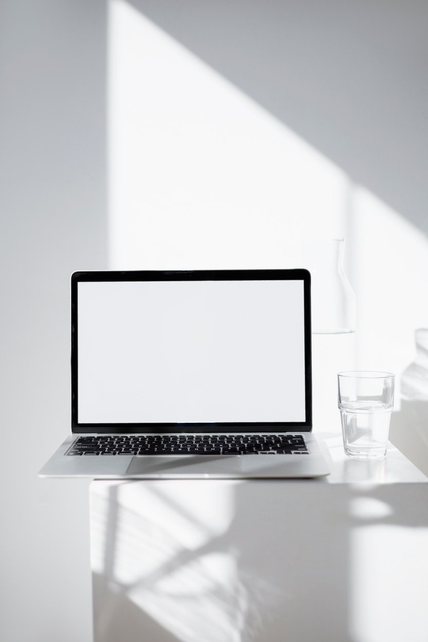 Macbook Mockup on White Table